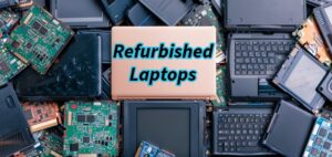 Refurbished laptop on a desk showing battery health report and system specifications on screen